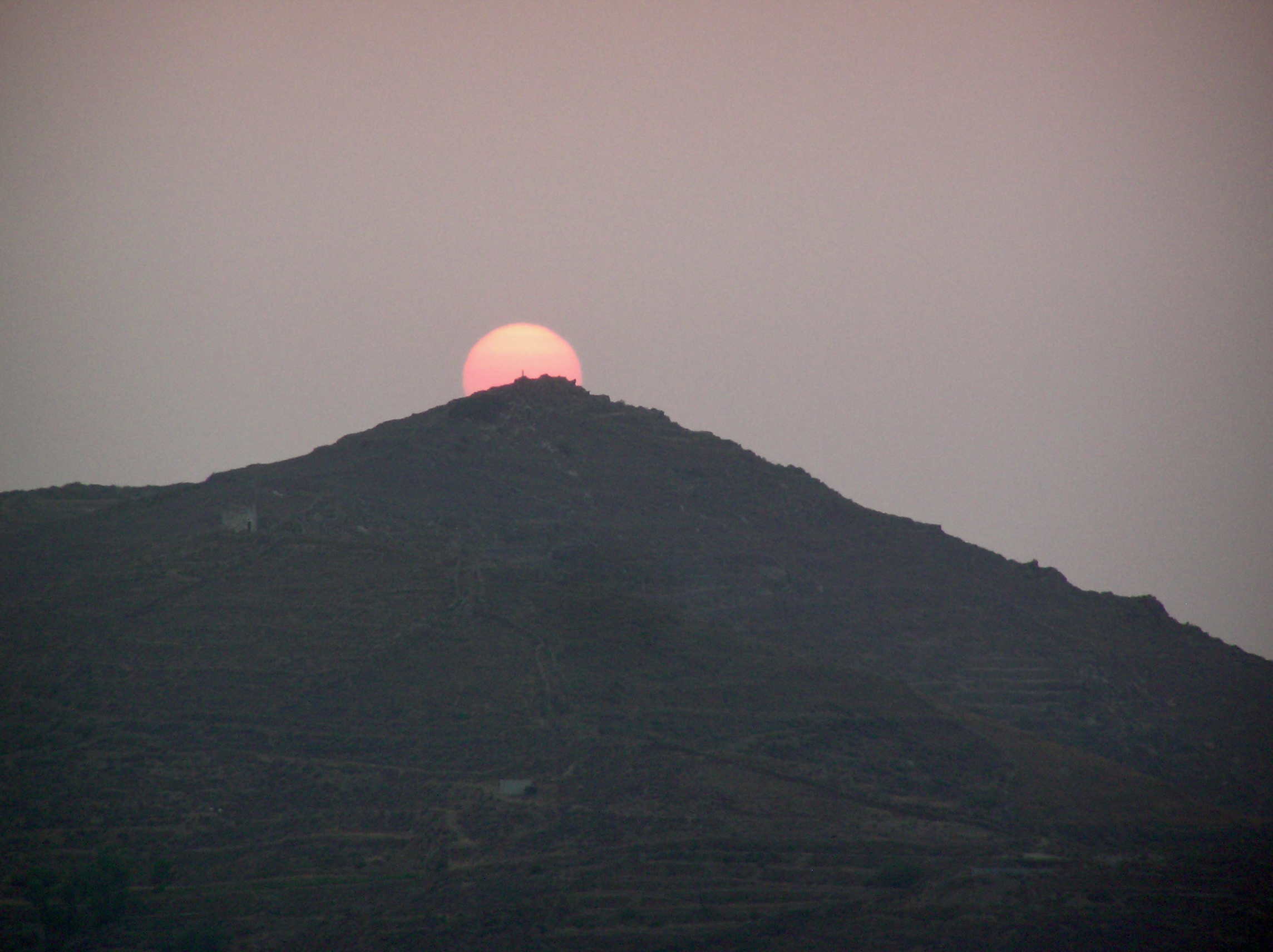 Picture of the sun setting over Tholaria, Amorgos